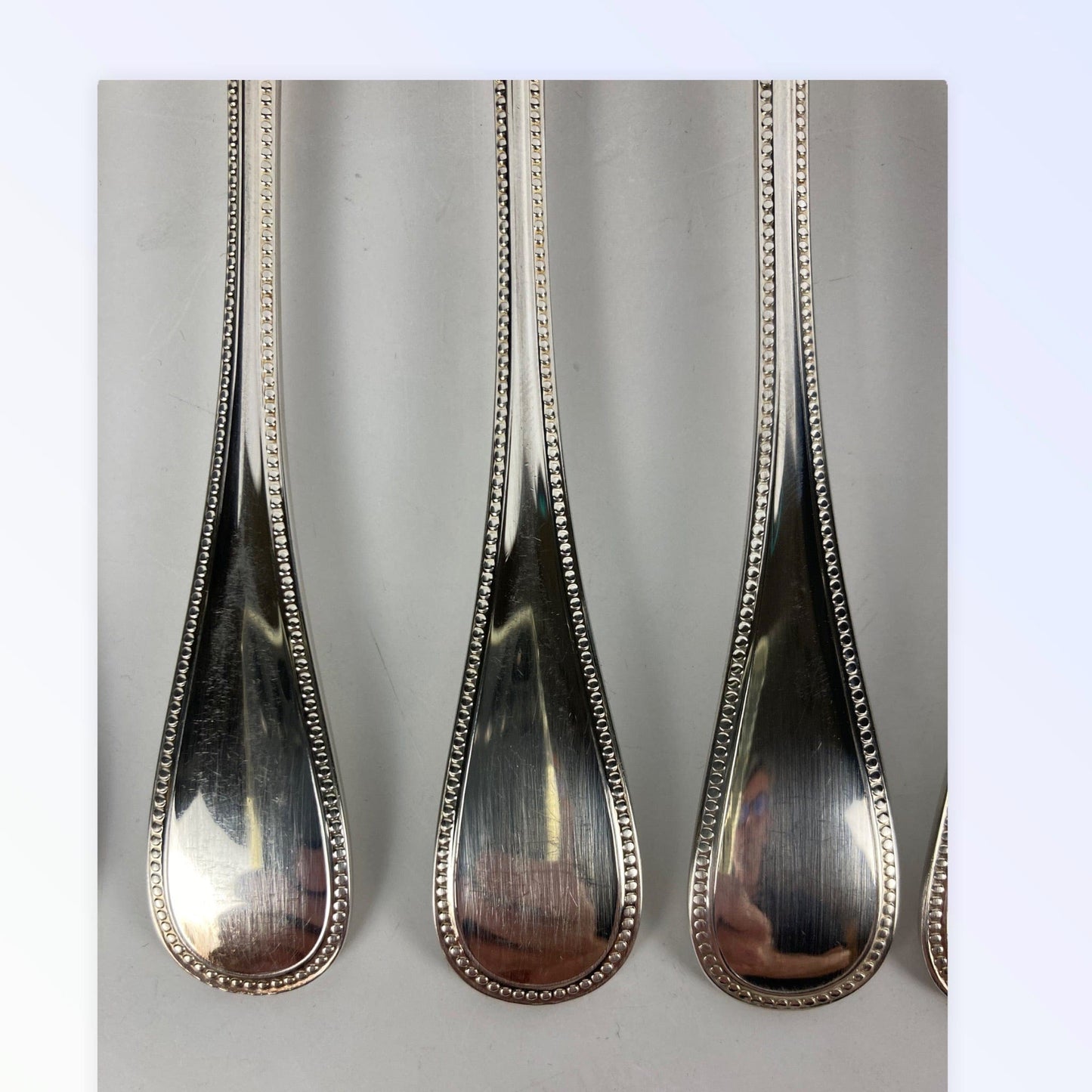 Maison Christofle 9 fourchettes à poisson modèle perle