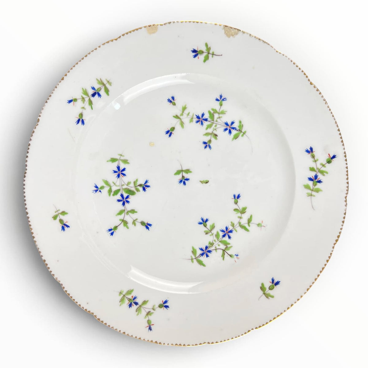 Ancienne assiette en porcelaine de Bordeaux XVIIIe siècle. Décor aux barbeaux.