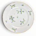 Assiette plate en porcelaine de Bordeaux à décor aux barbeaux.