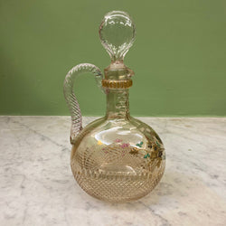 Antique cut crystal carafe decorated with a bird on gilded and enamelled branches