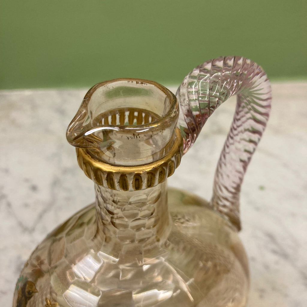 Carafe ancienne en cristal taillé a décor d' un oiseau sur des branchages dorés et émaillés