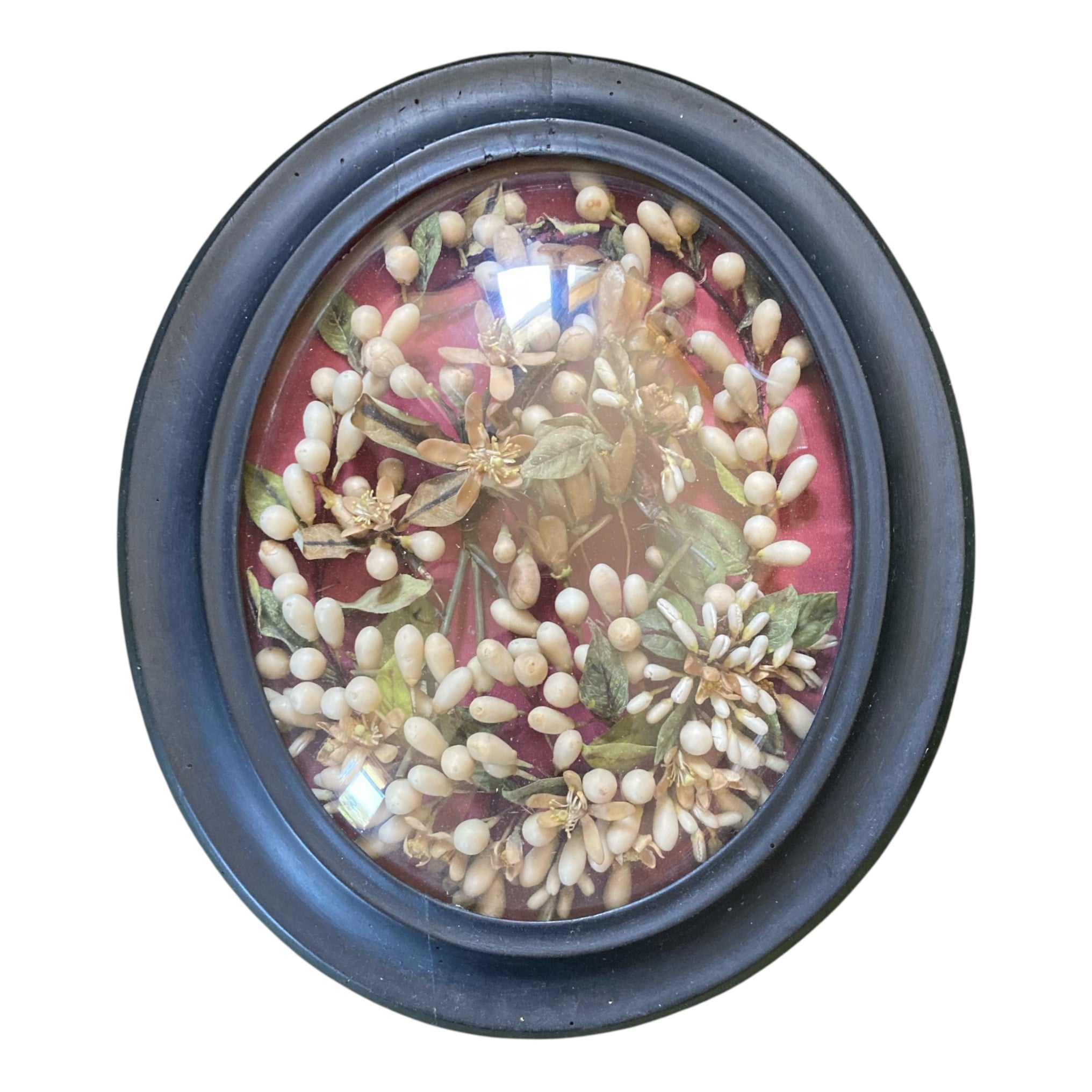 Ancienne couronne de mariée Napoléon III dans un cadre ovale noir et verre bombé.