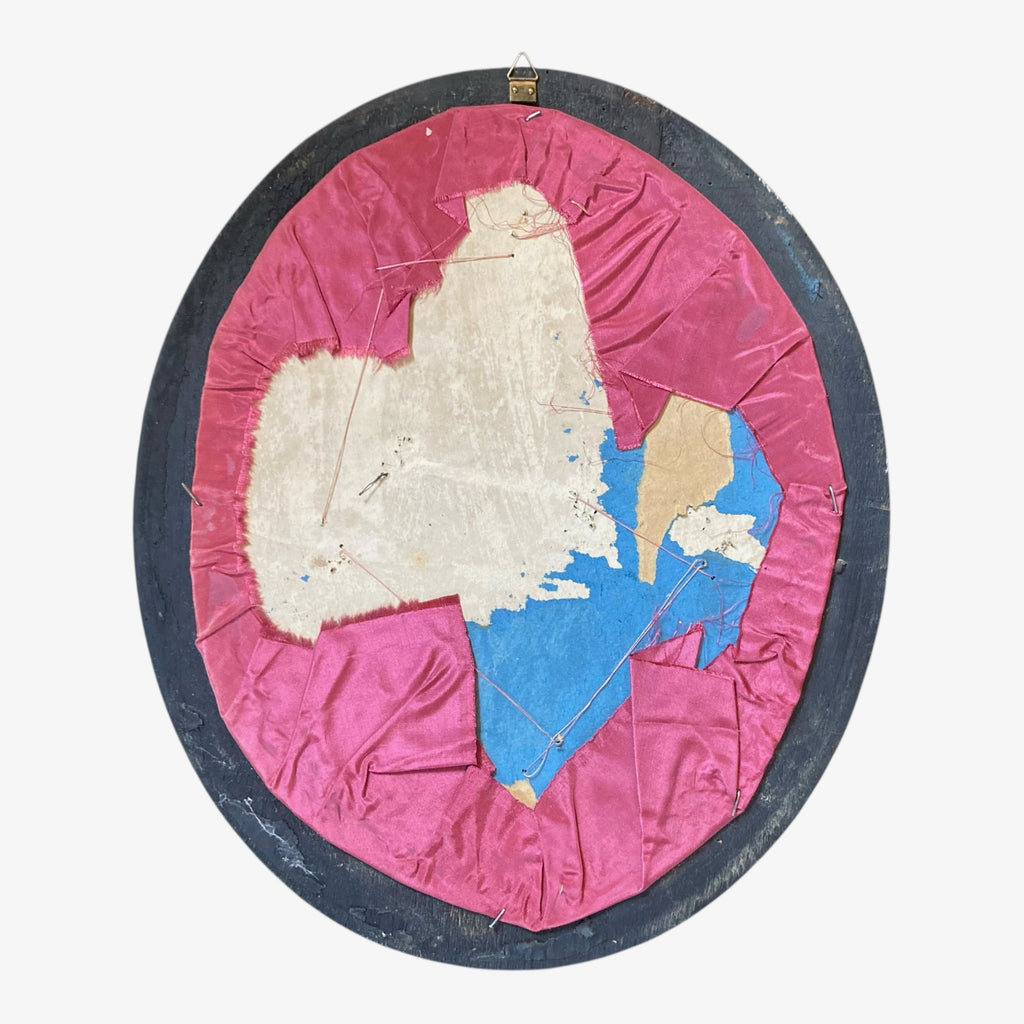 Ancienne couronne de mariée Napoléon III dans un cadre ovale noir et verre bombé.