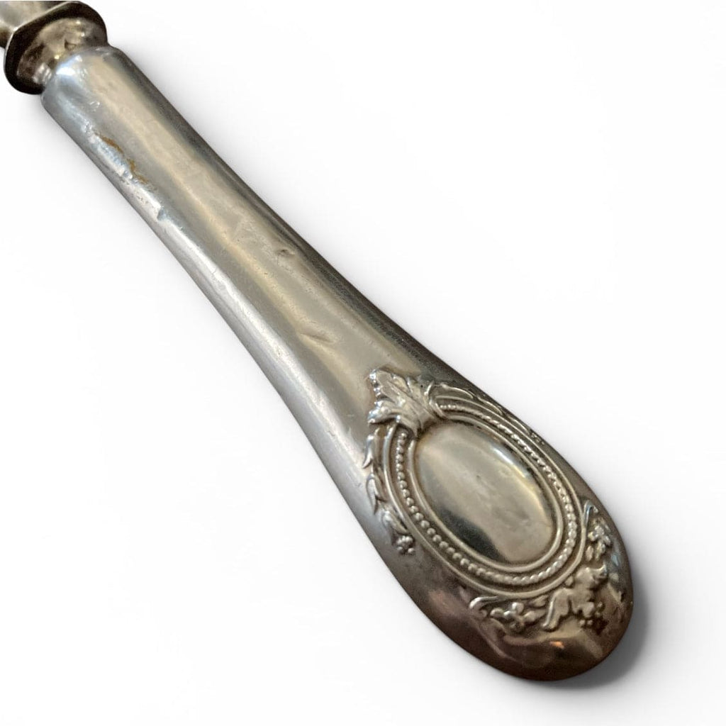 Ancienne cuillère saupoudreuse en argent massif du 19ème.