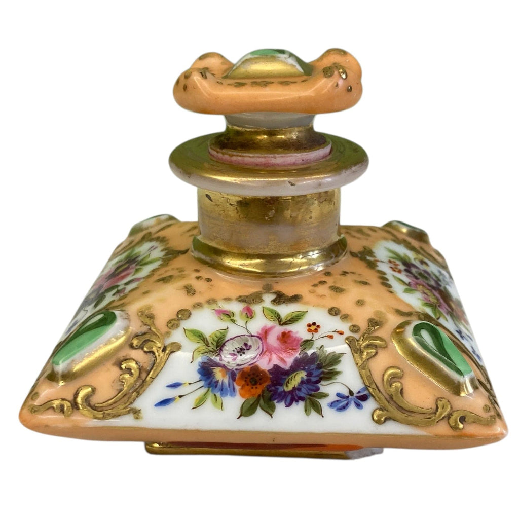 Flacon de parfum ancien en porcelaine polychrome et dorée à décor de fleurs.