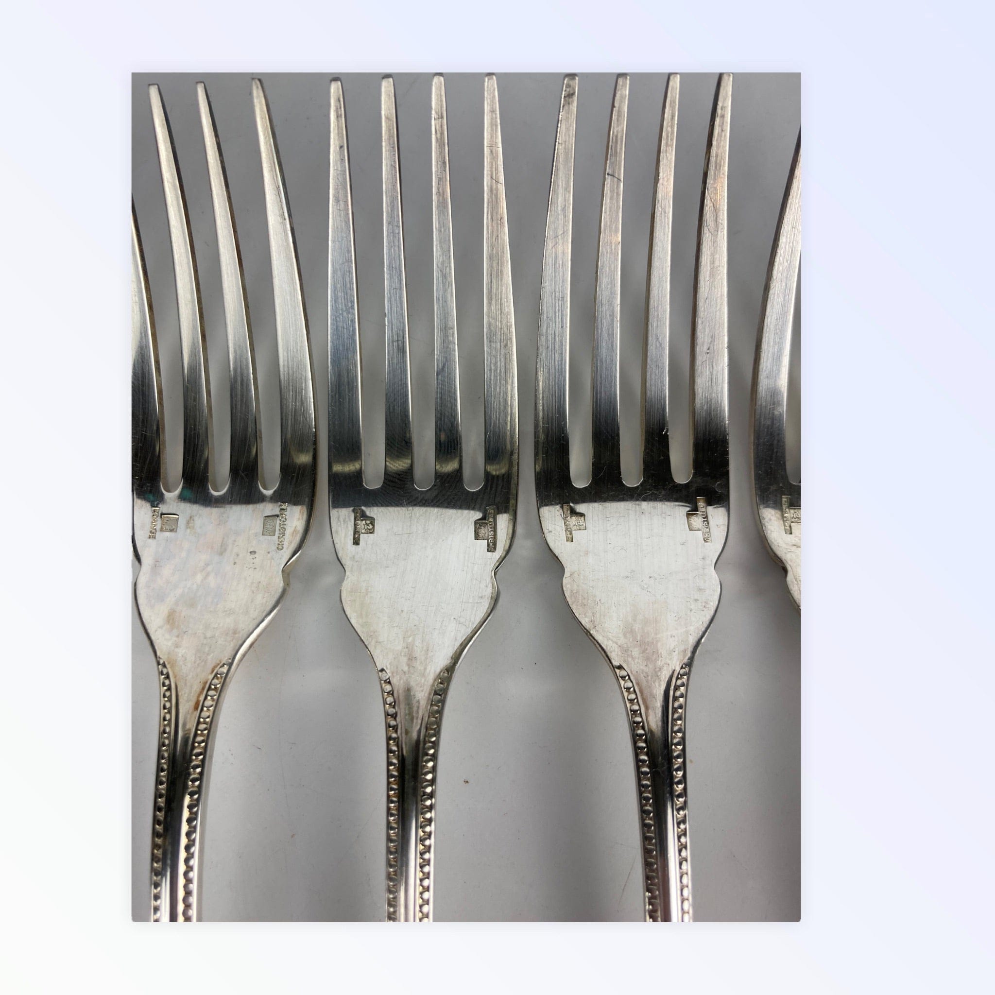 Maison Christofle 9 fourchettes à poisson modèle perle