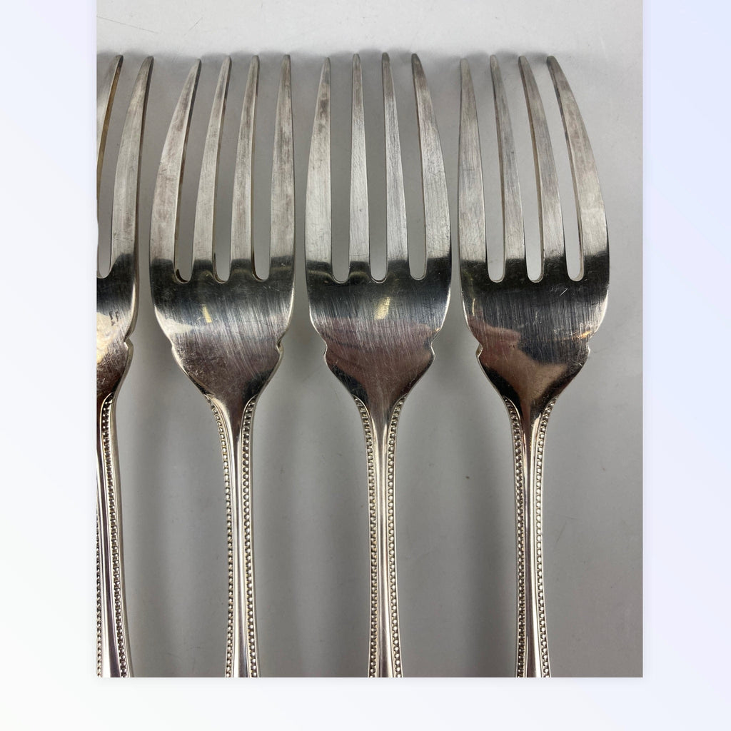 Maison Christofle 9 fourchettes à poisson modèle perle